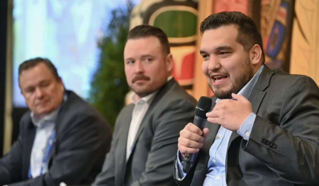 ISAIAH ROBINSON SPEAKING ON A PANEL AT THE INDIGENOUS RESOURCE OPPORTUNITIES CONFERENCE TO REPRESENT THE KITASOO XAI’XAIS COMMUNITY